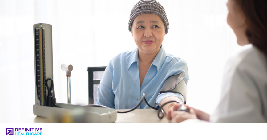 A doctor talks to a patient during a clinical trial. 