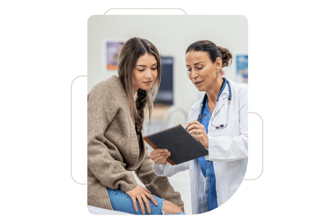 A healthcare professional and patient look down at a tablet.