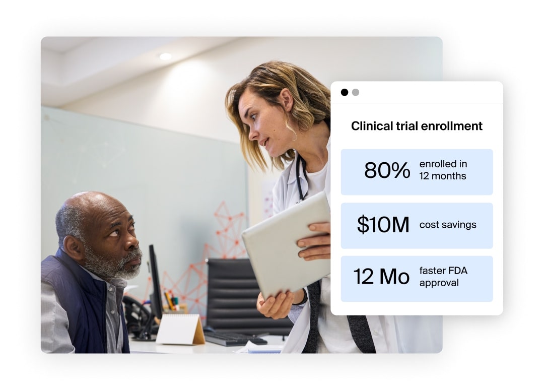 A male patient sits looking at a female healthcare provider as she stands holding a tablet. Clinical trial enrollment data is featured on top of the image.