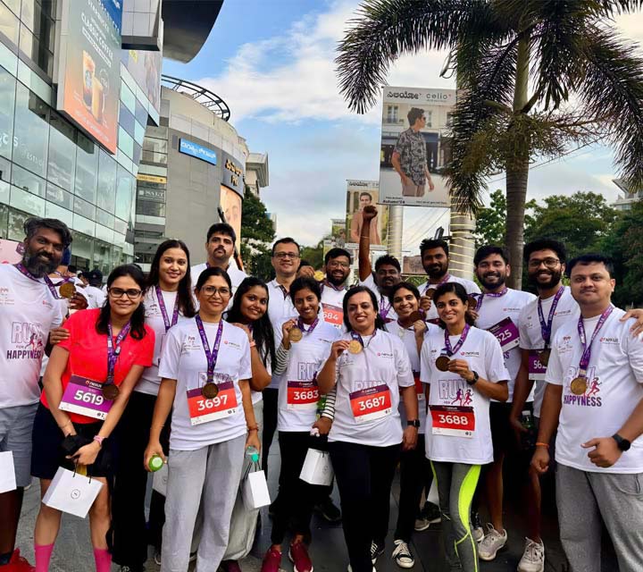 A group of DH employees pose for a picture after an event.